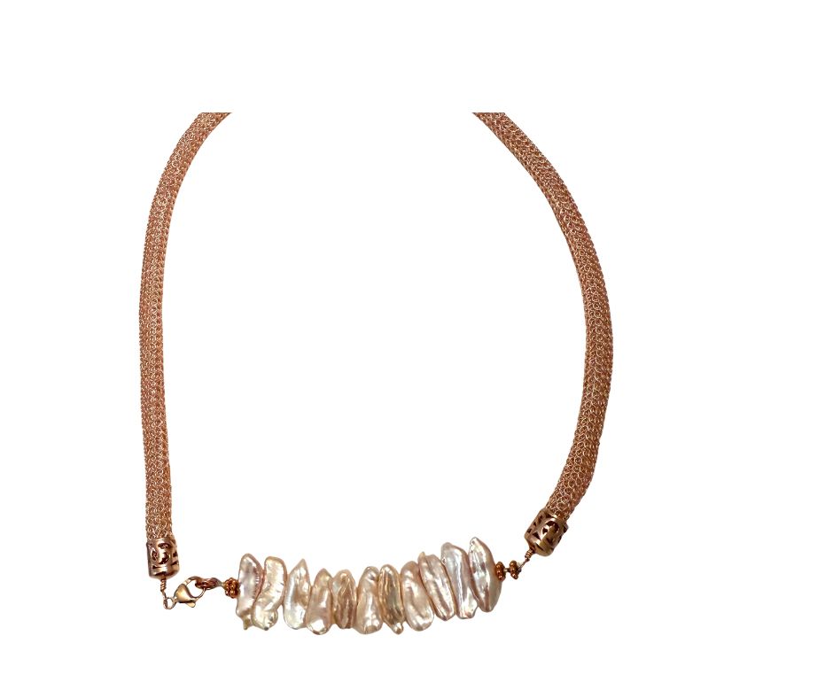 Necklace with rose gold chain and biwa pearls on a white background
