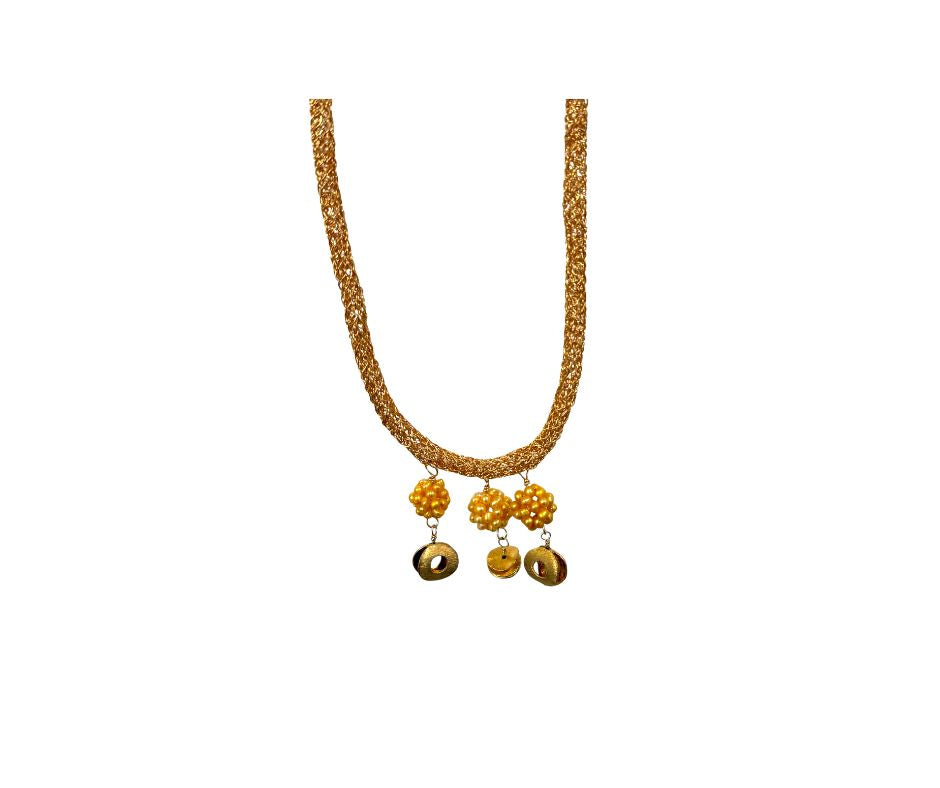 Gold necklace with yellow beads on a white background