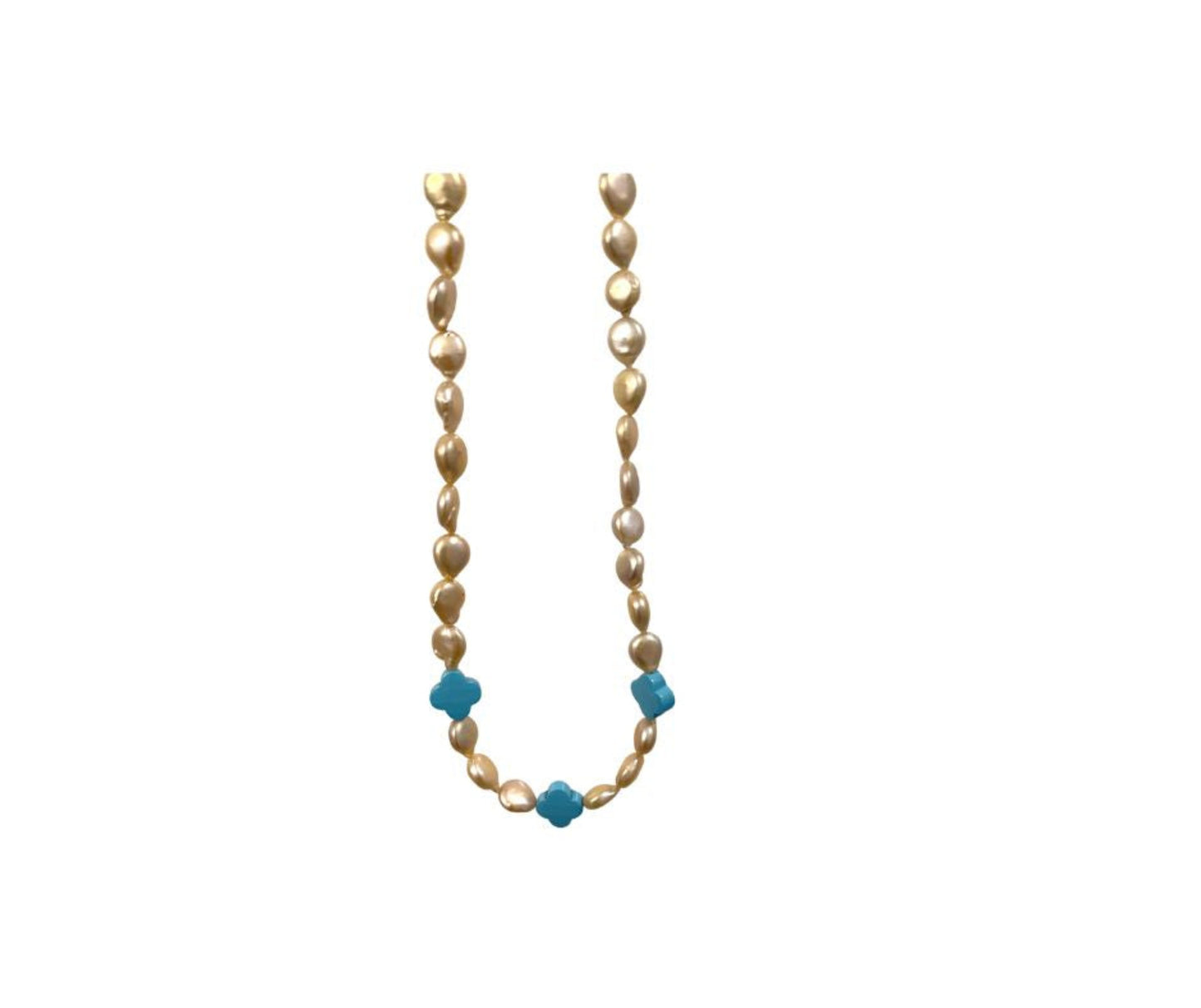 Necklace with alternating champaign coin pearls and turquoise on a white background