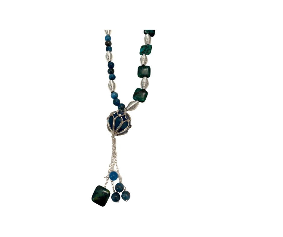 Necklace with green and silver beads on a white background