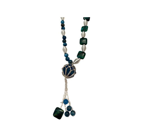 Necklace with green and silver beads on a white background