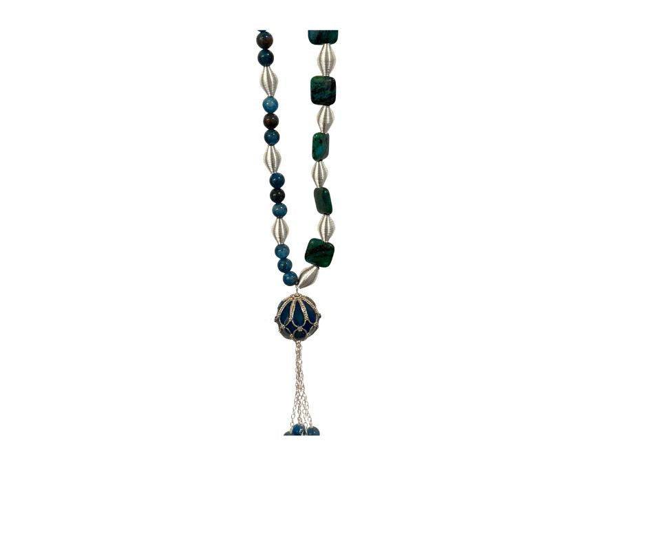 Necklace with green and silver beads on a white background