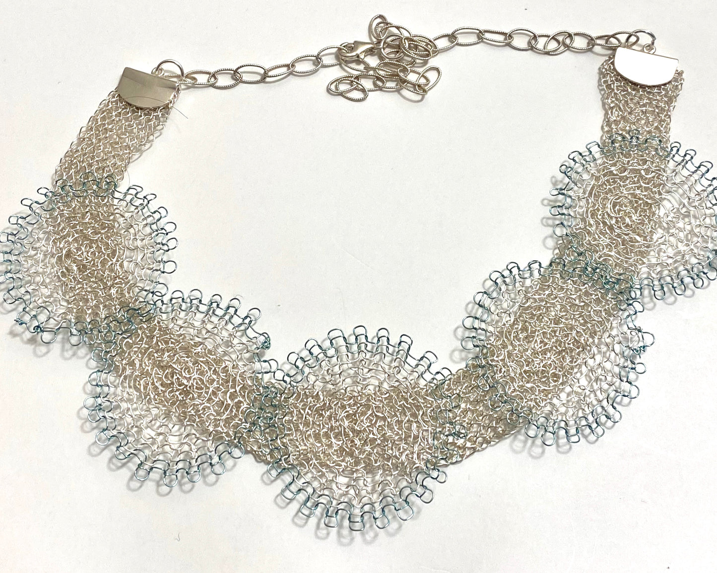 Fine silver and light blue flowers on a beautiful fine silver hand made chain with an extender chain to adjust the length.