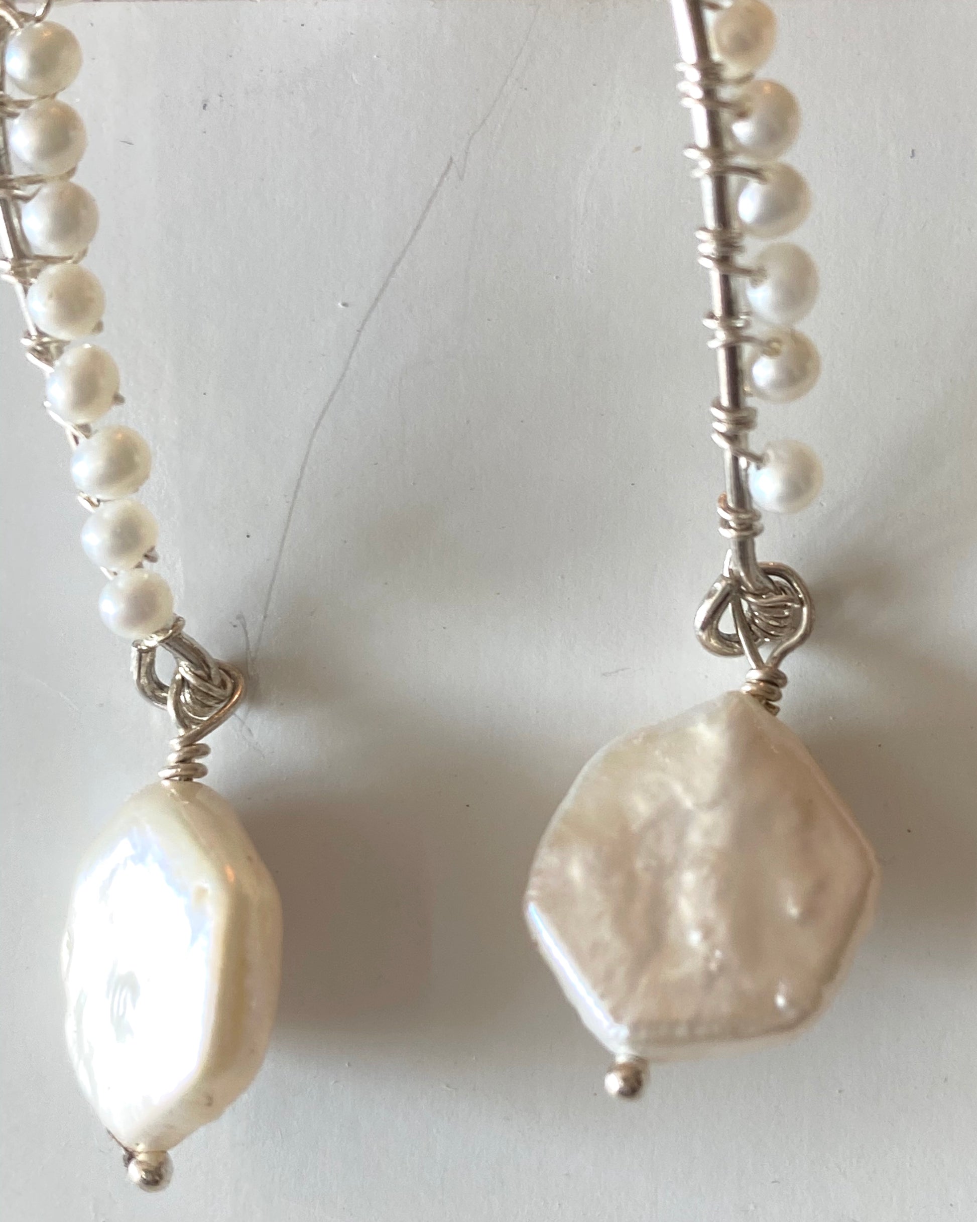 Fresh water round pearls with a hexagon fresh water pearl dangling.