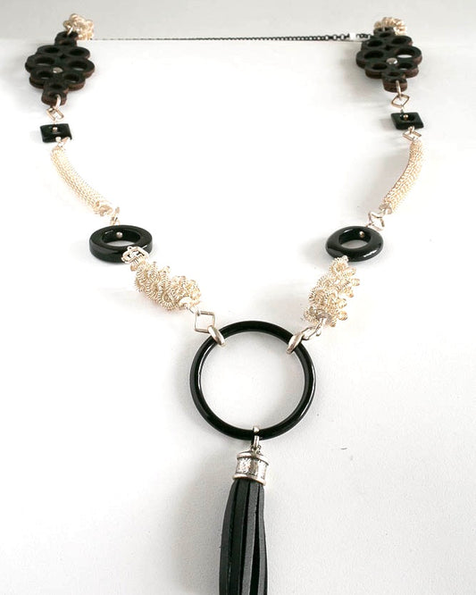 Hand made fine silver beads, leather beads and onyx focal point with tassel . 40 inches