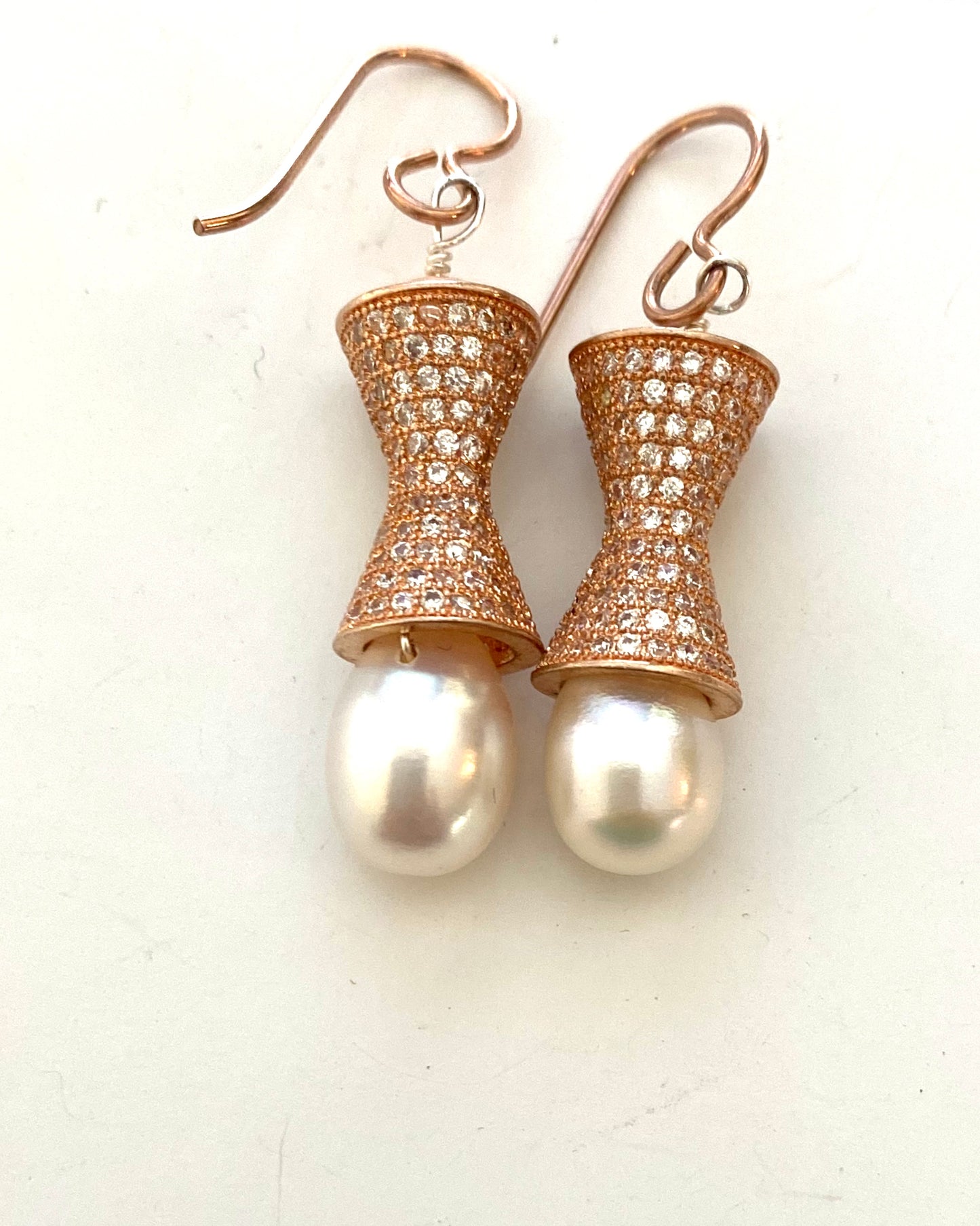 Rose Sterling Silver Earrings with Fresh water pearls hang about one and half inches. By pretaporterjewels.com jewellery that invites compliments.