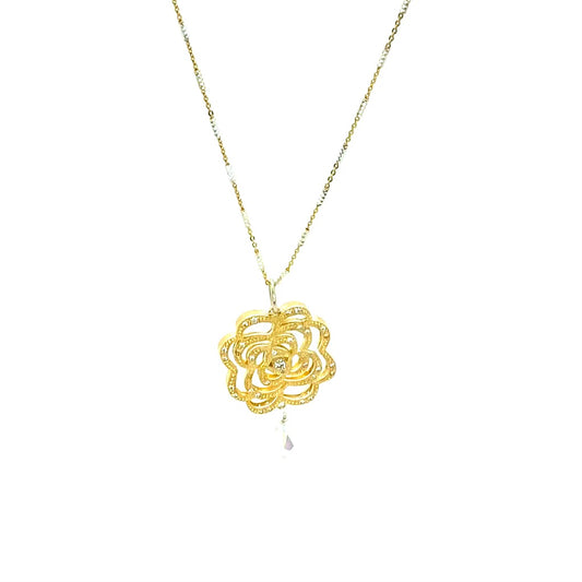 Gold flower pendant on gold and silver chain