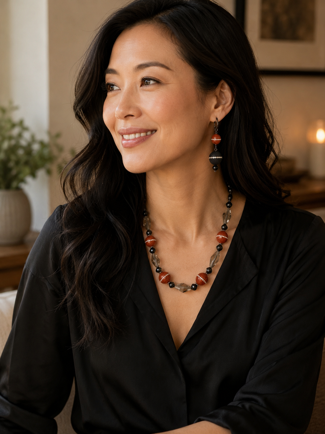  Pret-A-Porter Jewels Toronto. Woman wearing necklace with warm cinnamon toned focal beads are accented with swarovski crystals.