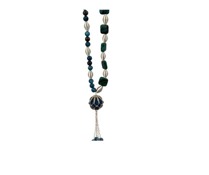Necklace with green and silver beads on a white background