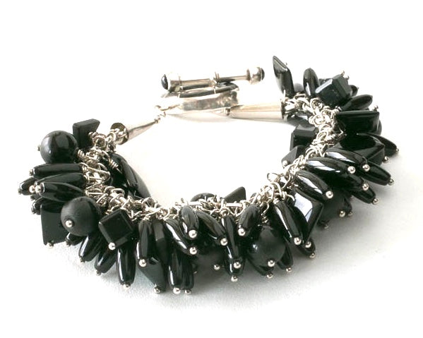 Onyx and Sterling Silver Charm Bracelet with inlaid toggle clasp.