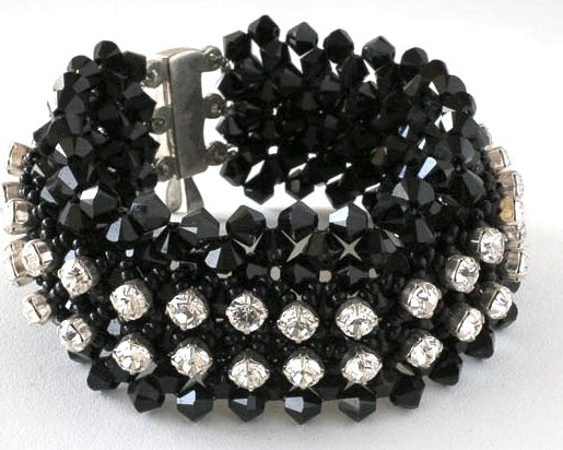 Black and clear Swarovski Crystal Bracelet with sterling silver clasp. The bracelet is a one inch wide cuff and 7 and one quarter inches long.