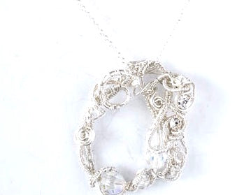 Fine silver framed pendant with clear Swarovski Crystal accents.