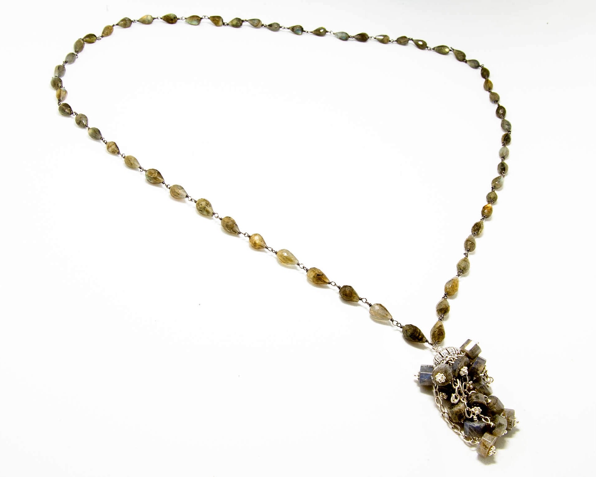Pear shaped Labradorite Stones with crystal cap on the tassel of this 36 inch necklace.