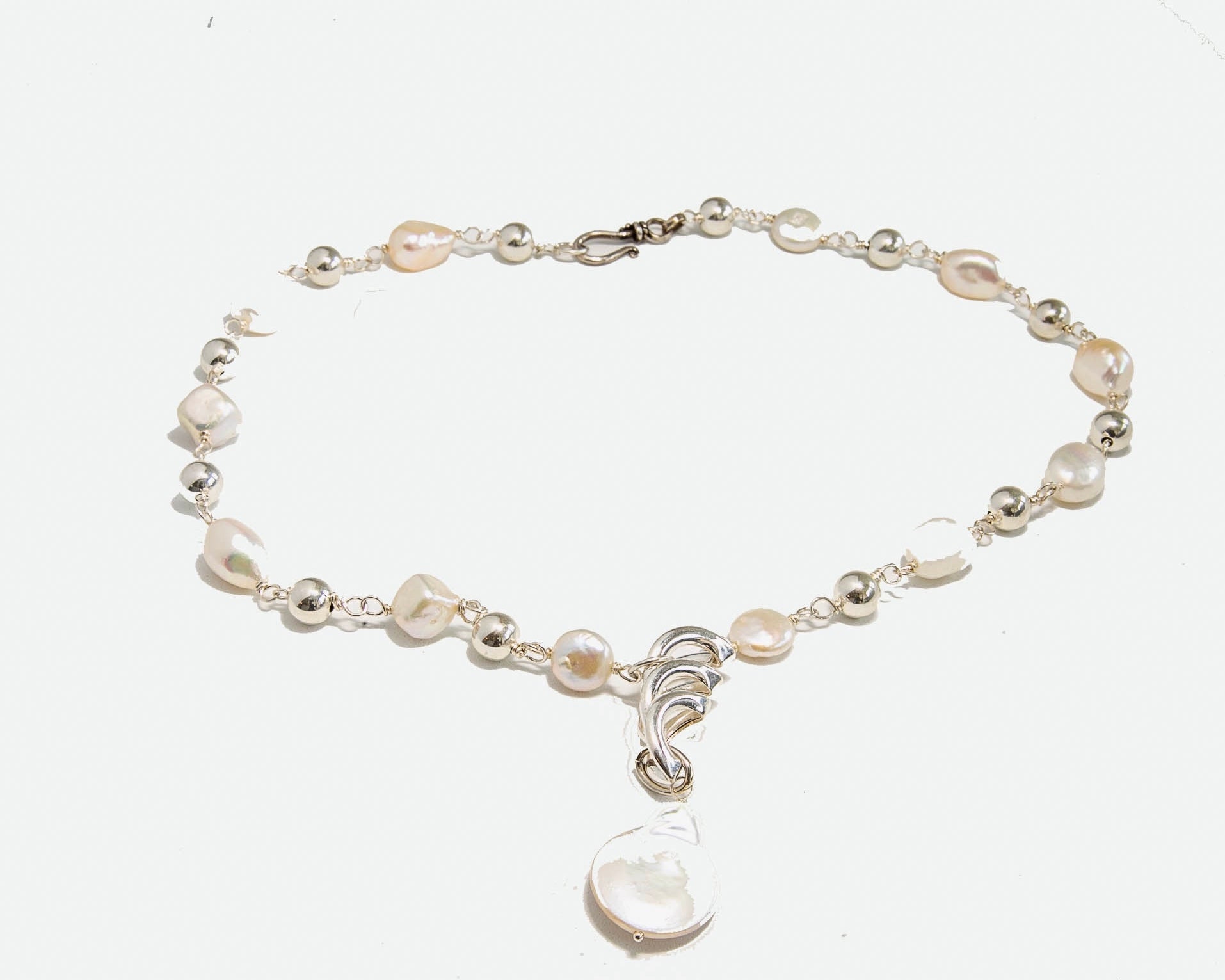 Fresh water pearl and sterling silver pendant necklace, 19 inches long with hook and eye closure.