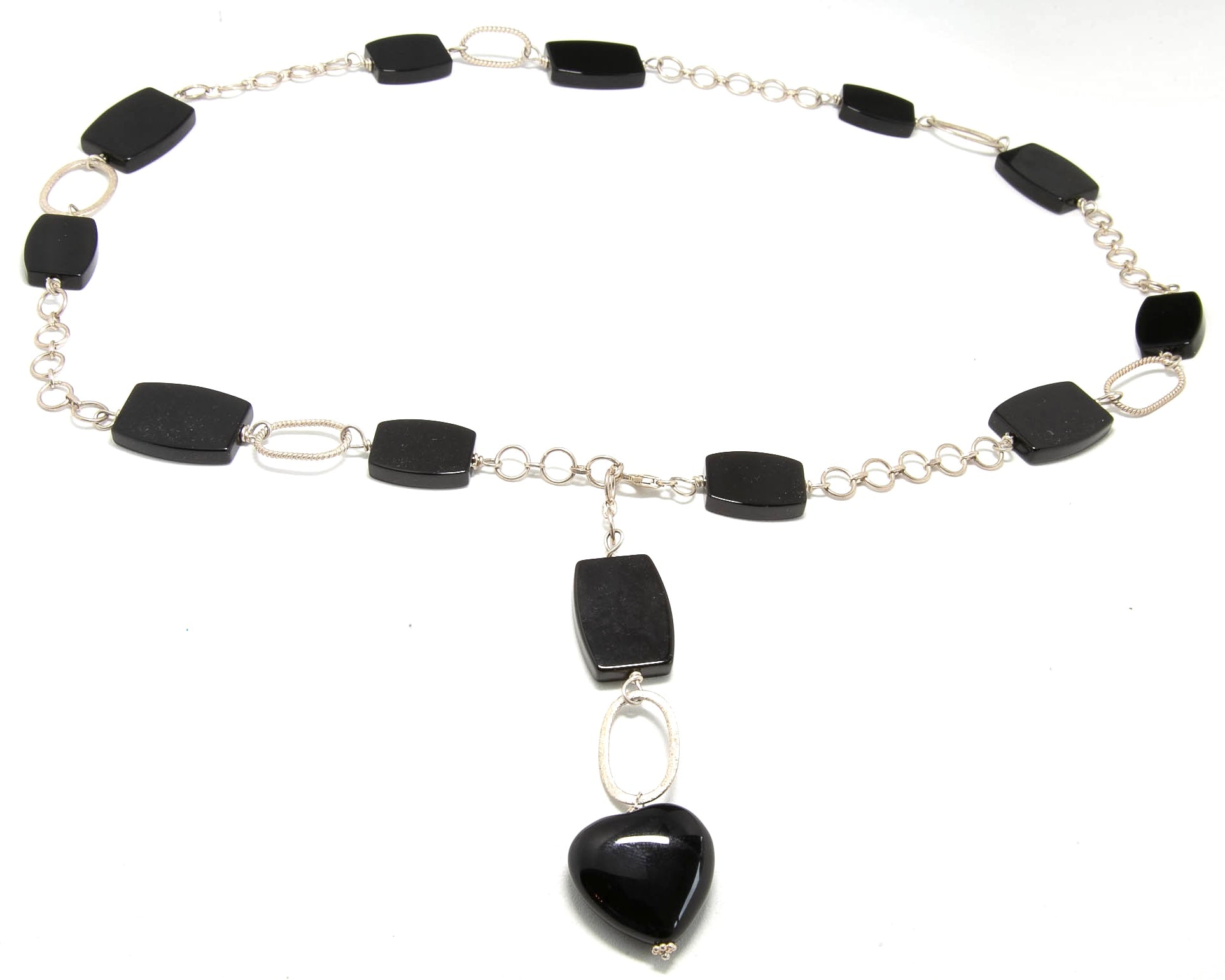 Black onyx rectangle stones connected with sterling silver chain with an onyx heart dangling. Front closure allows for adjustment based on neckline.