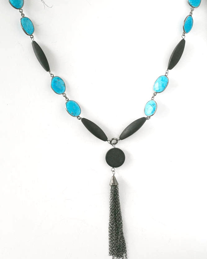 Natural Turquoise and onyx necklace accented with oxidized sterling silver. Black tassel hanging.