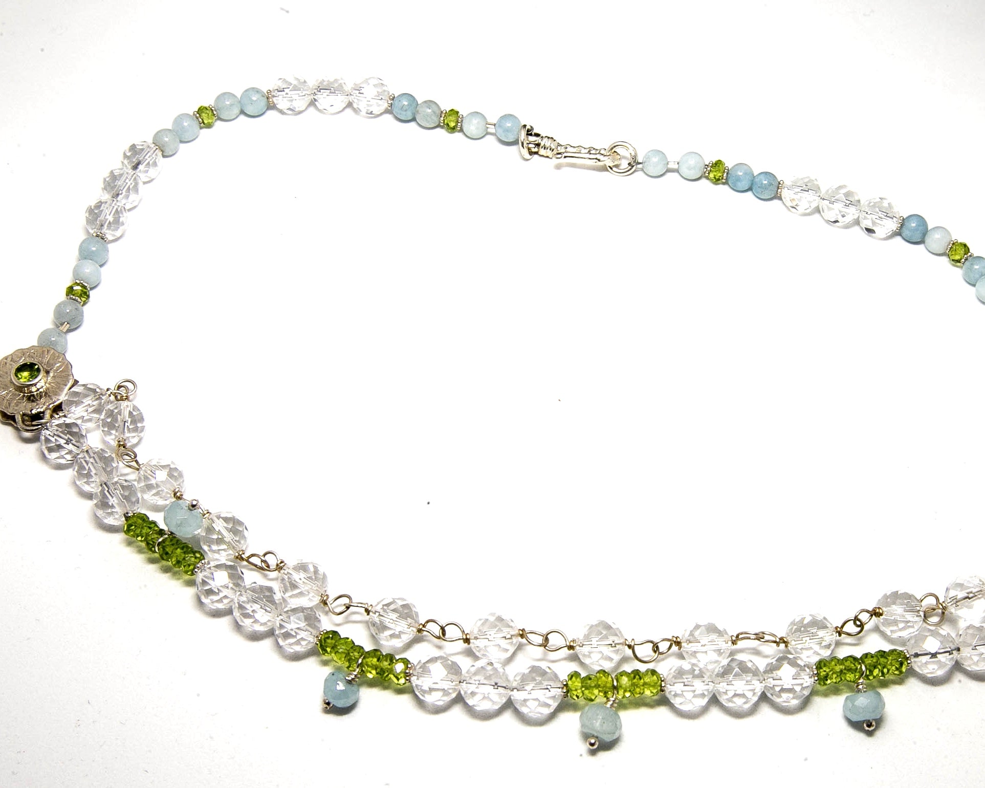 Clear Quartz, Peridot and Aquamarine two strand necklace with sterling silver hook closure.
