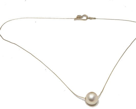 Single round fresh water pearl on a sterling silver 18 inch chain.