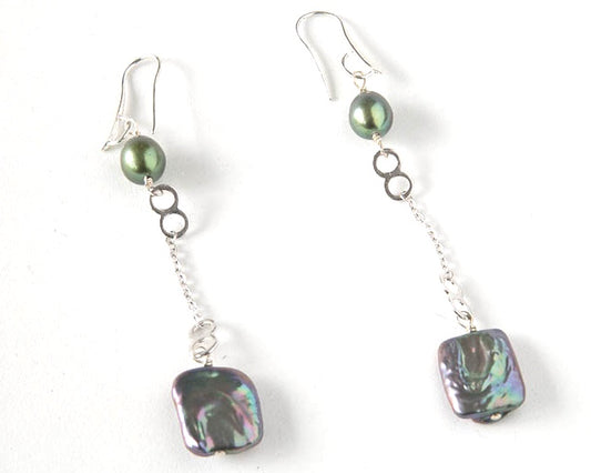 three inch long fresh water pearl earrings in jewel tones on a sterling silver hook.