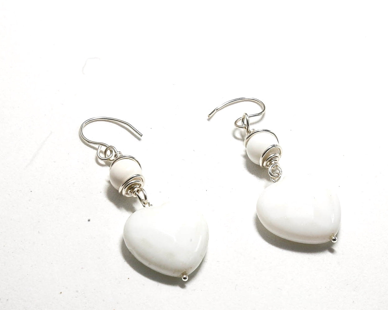 White Onyx Heart Earrings with sterling silver ear wire.