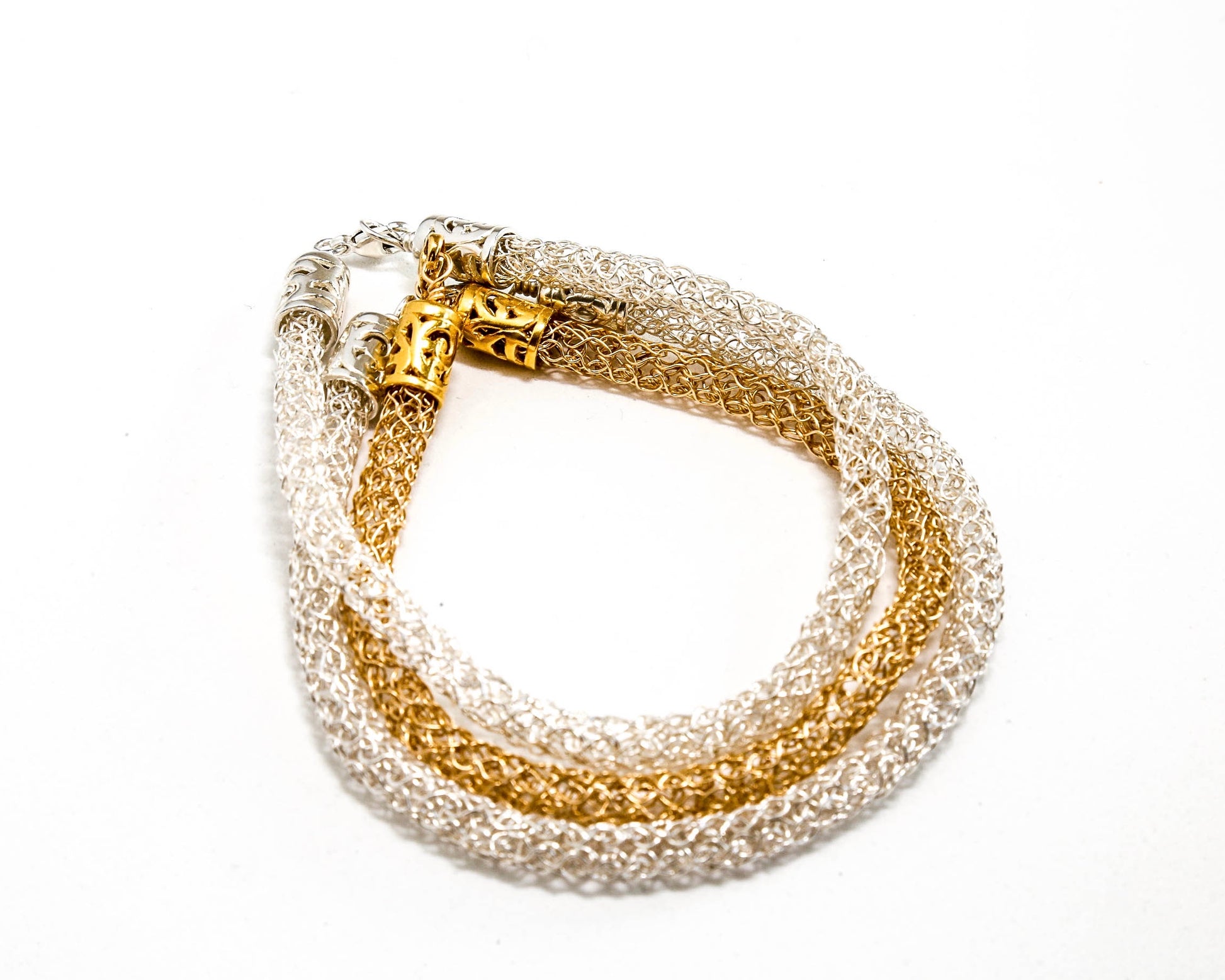 Hand knitted bracelet stack in Fine silver and Gold Filled