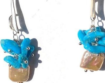 Turquoise cluster and square fresh water peach coloured pearl earrings on a sterling silver hook.